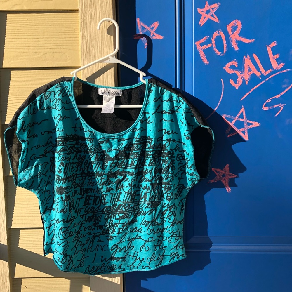 Turquoise top with black writing design
